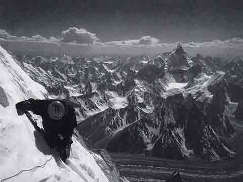 
Gasherbrum IV First Ascent West Face Central Spur - Yoo Huk-jae At 7900m Descending From Gasherbrum IV Summit July 18, 1997 With Masherbrum In Distance - American Alpine Journal
